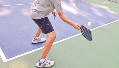 Men's Pickleball Shorts: A closeup of someone playing pickleball